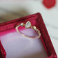 Side view of the adjustable open band with teardrop cabochon in a red velvet box