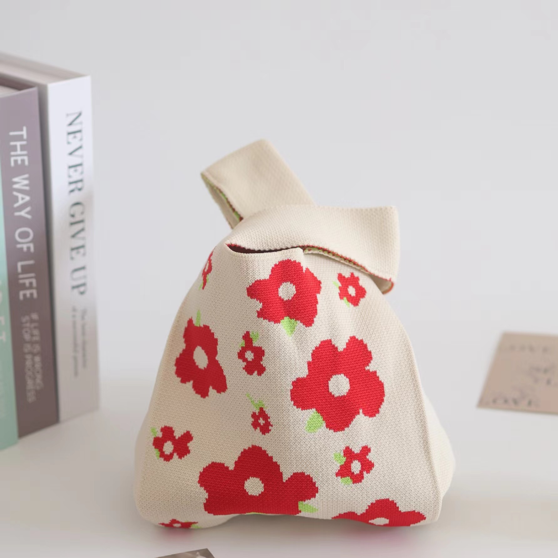 Polyester knit handbag with a jacquard design worked into the fabric