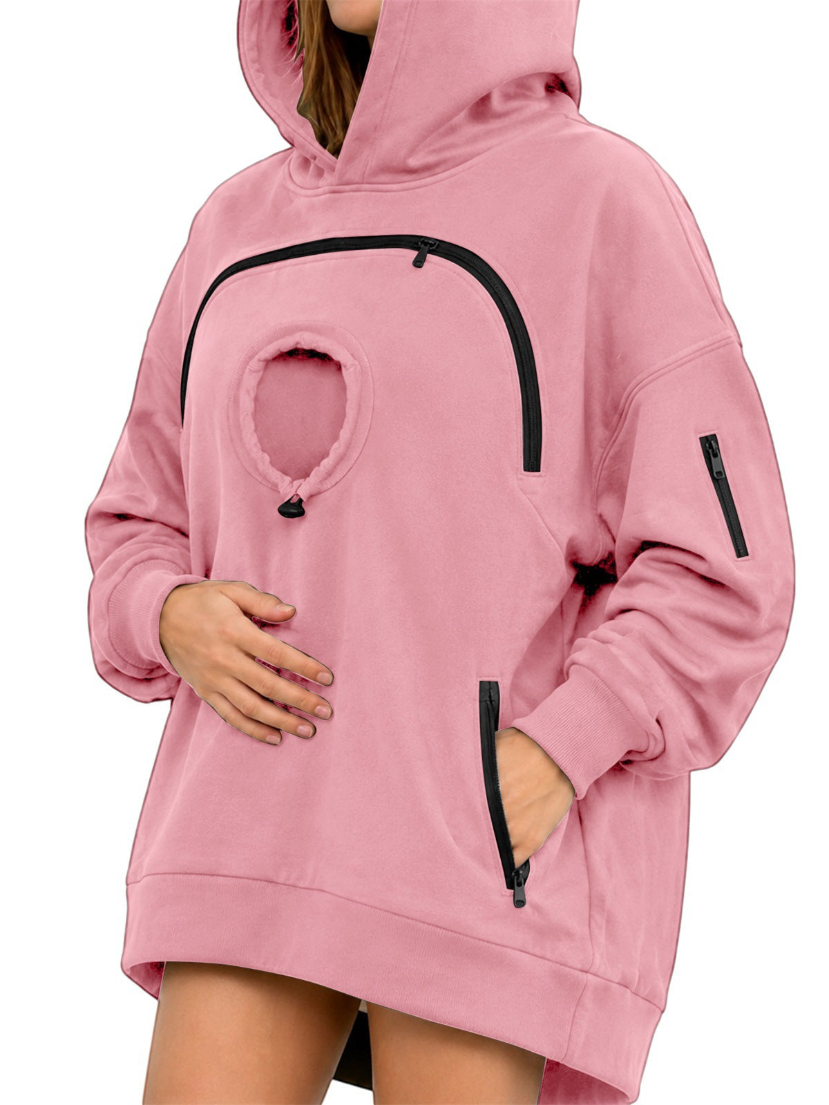 Pink oversized fleece hoodie with a round chest pocket, arched zipper and a zip pocket on the sleeve