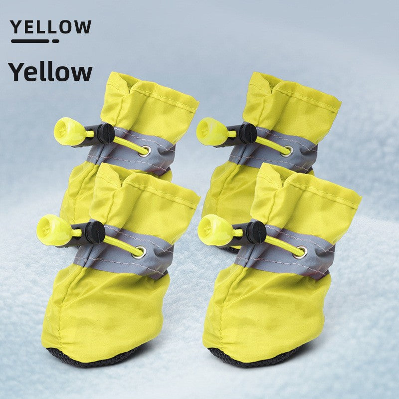 Set of four black non slip dog boots with waterproof Oxford upper and toggle closure