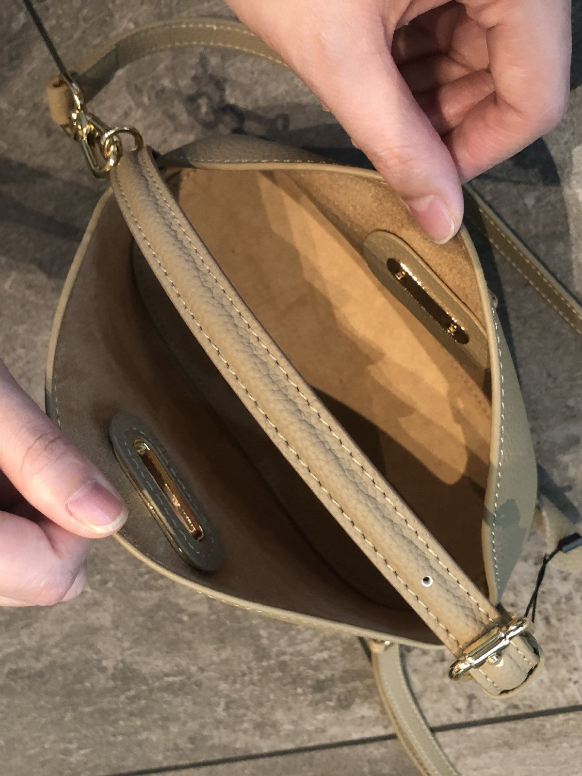 Leather crossbody bag showing adjustable single strap detail