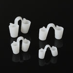Four soft white solid silicone nose vents in graded sizes on a black background