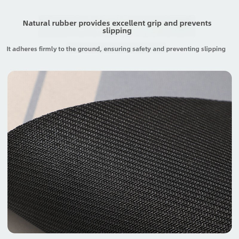 Close-up of the black ribbed natural rubber backing of the semi-circular diatomite bath mat