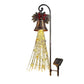 Front view of the solar Christmas bell yard light with red bow, star and bell charms on the strands, white background