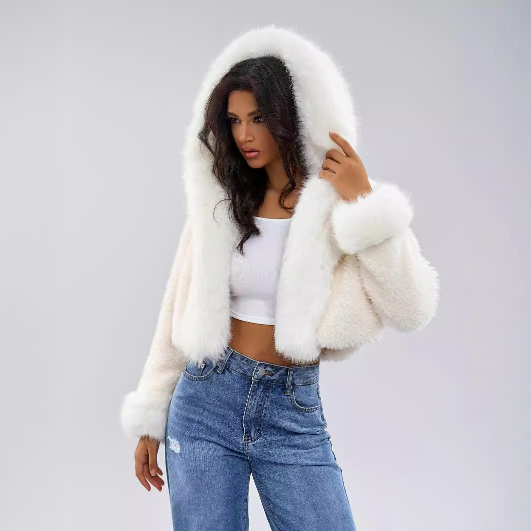 White cropped faux fur jacket seen from the side to show the hood and short length