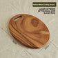 Walnut board with a large round hole handle shown hanging on a hook