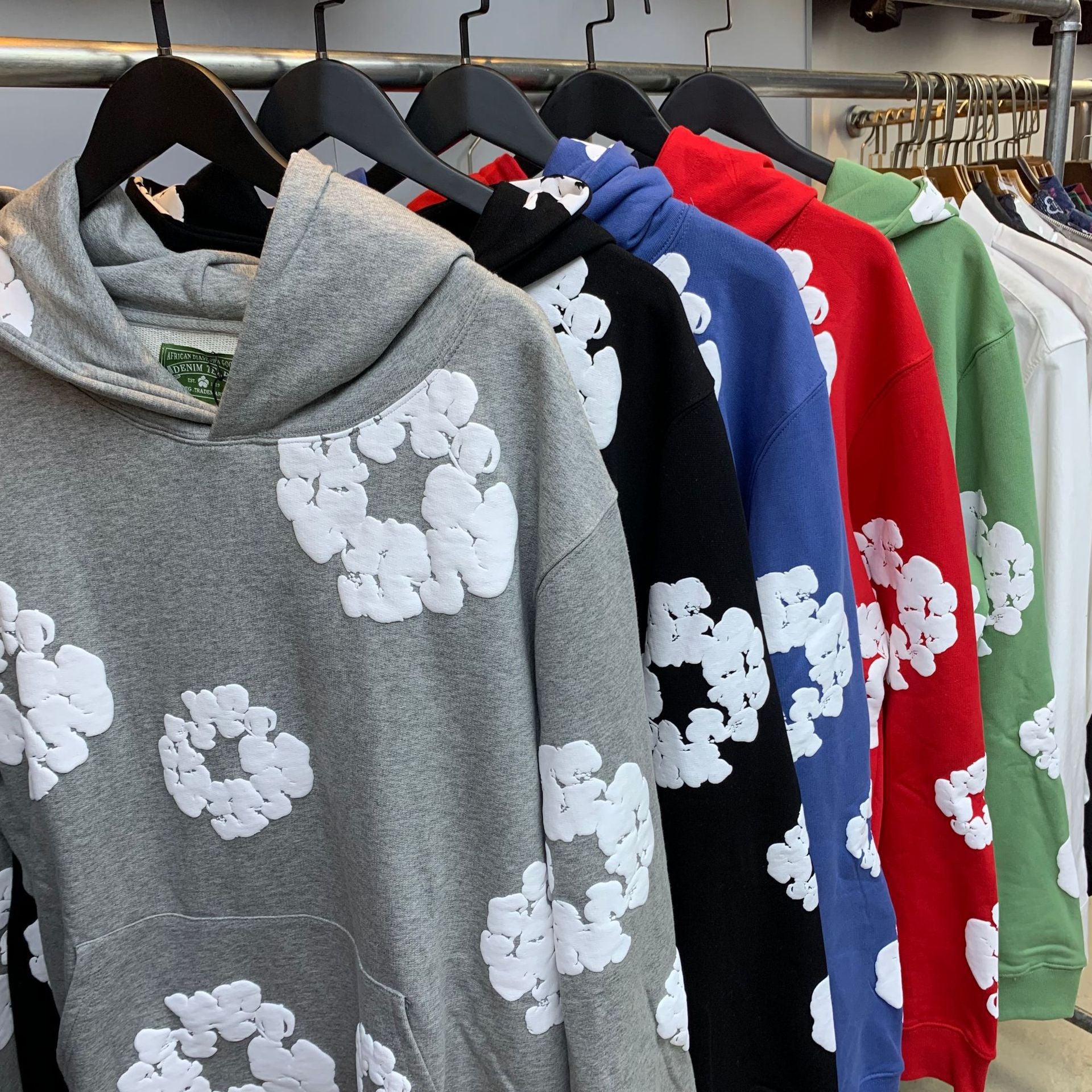 Cotton wreath print hoodie worn with the hood pulled up over the head