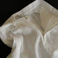 Inside waistband of white linen shorts with belt loop, zip fly and clean lining
