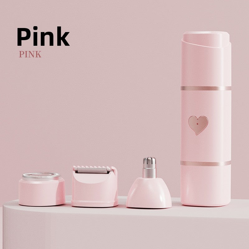 Soft pink mini shaver body on a pink podium beside its foil, blade and nose heads