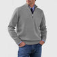 Light gray mens acrylic knit quarter zip stand collar pullover sweater worn by a standing male model