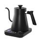 Angled view of a black gooseneck kettle with the lit temperature display on its control base