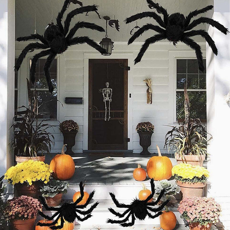 Hairy black Halloween spider prop with red eyes, flocked body and eight posable bendable legs
