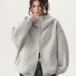 Deep hood of the heavyweight sweatshirt pulled up over the head and framing the face
