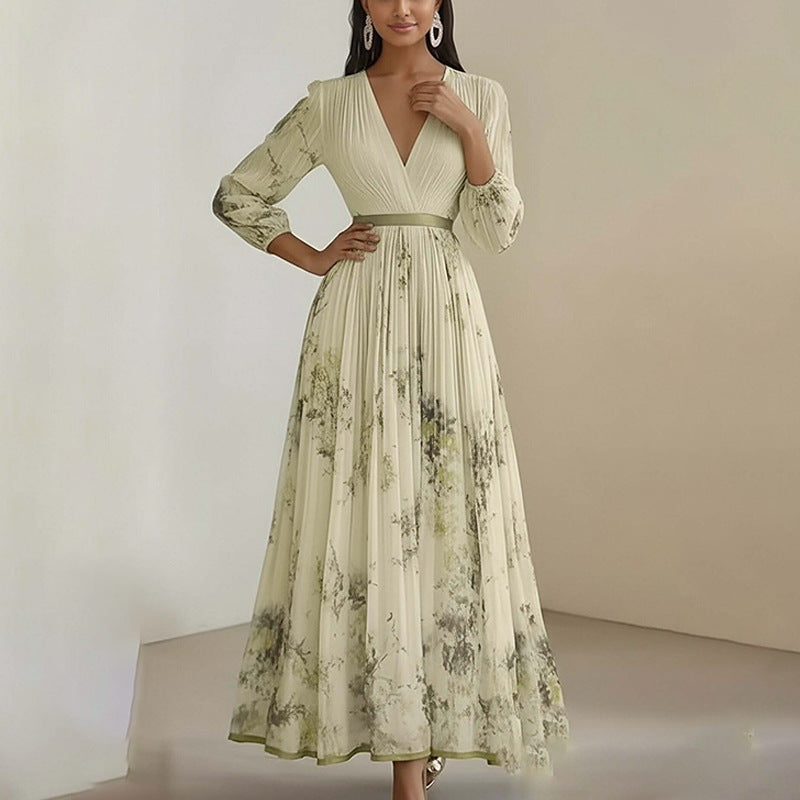 Floral print pleated maxi dress hem and skirt drape detail close up view