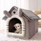 Gray house style pet house with a small dog resting inside