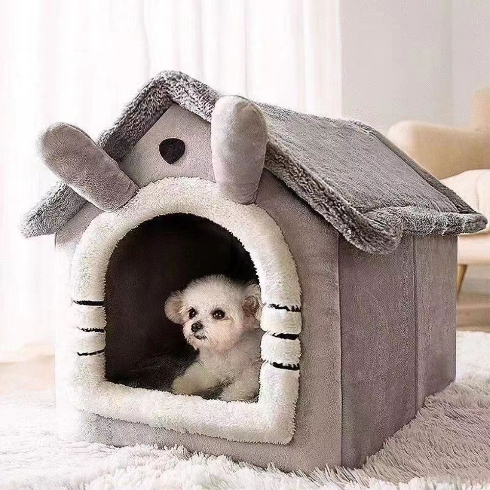 Gray house style pet house with a small dog resting inside