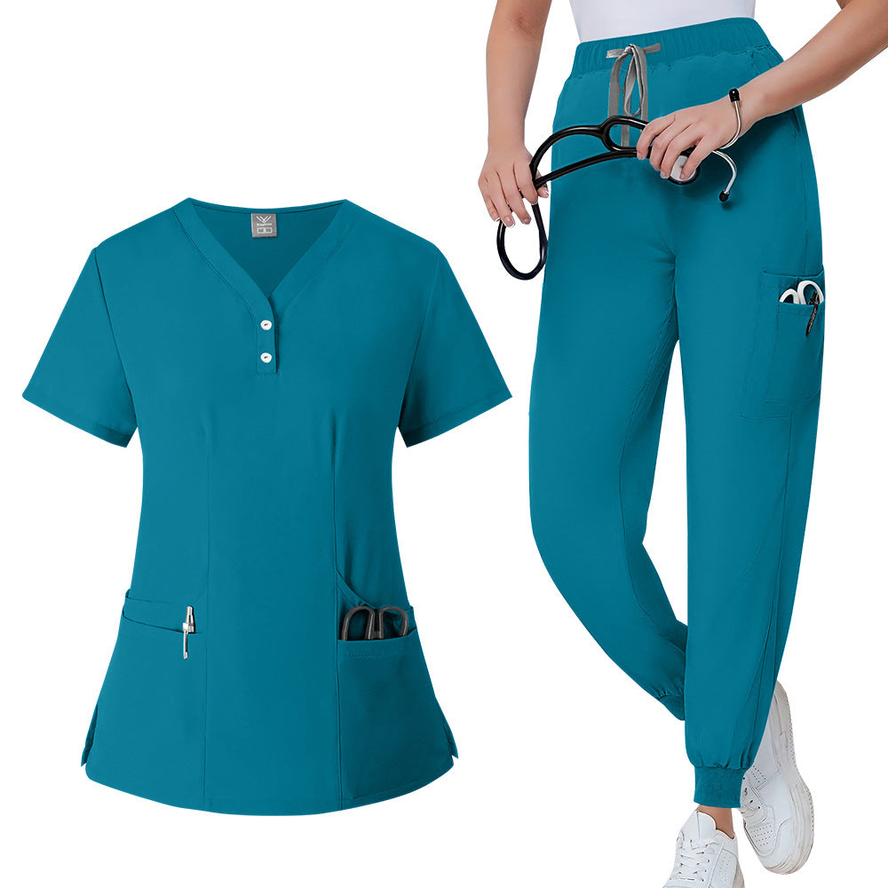 Womens V neck scrub top in lavender worn from the front to show the fitted cut