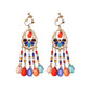 Boho vintage clip-on drop earrings with fringe and bead accents, zinc alloy build, studio image on white background
