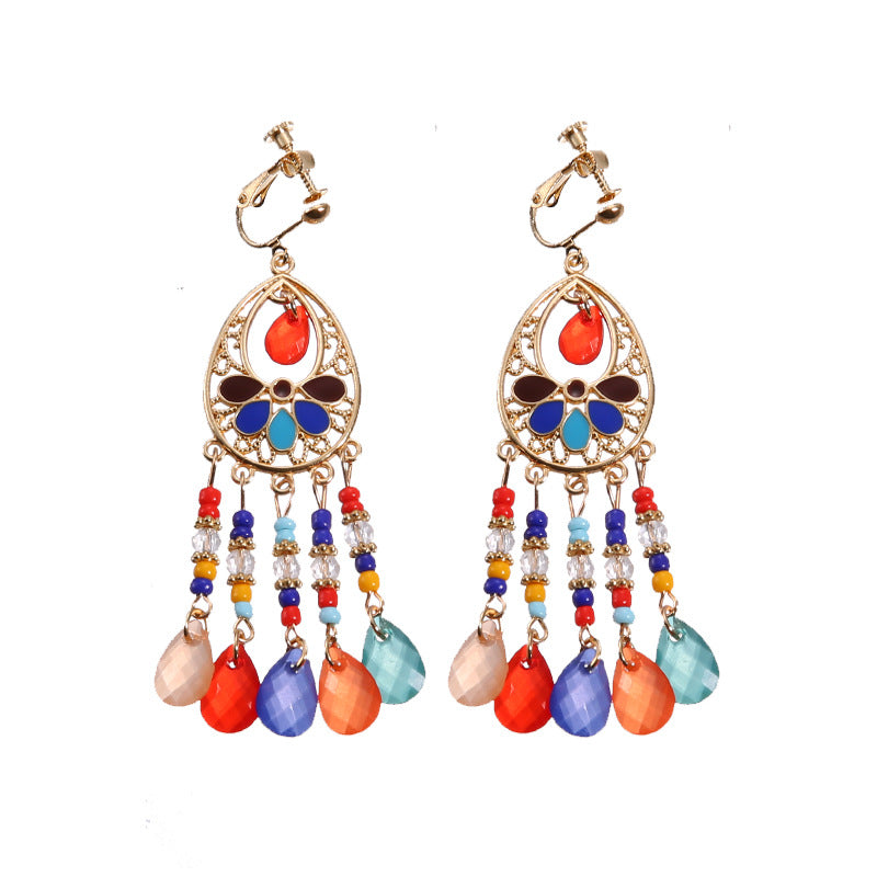 Boho vintage clip-on drop earrings with fringe and bead accents, zinc alloy build, studio image on white background