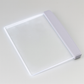 LED reading light panel used flat on a hardcover book angle