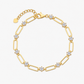 Top down view of the loop chain arranged on a soft fabric backdrop