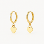 Heart shaped 18K gold ear cuff worn on the outer ear ridge