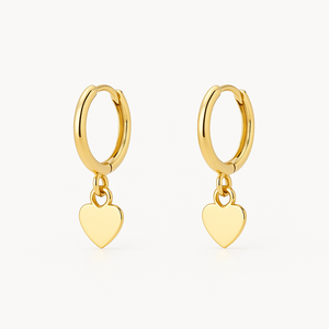 Heart shaped 18K gold ear cuff worn on the outer ear ridge