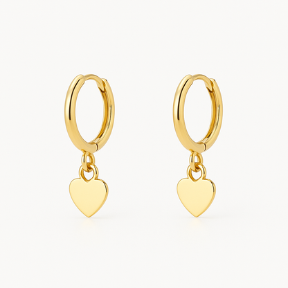 Heart shaped 18K gold ear cuff worn on the outer ear ridge