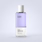UDR body essence oil bottle with lavender layer and white cap on a premium neutral background