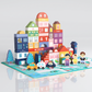 Colorful painted wooden building blocks set built into a toy city with cars, trees and figures on a city map base plate