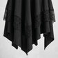 Close macro of the black asymmetrical pointed hem skirt with dark lace trim panels and layered handkerchief points