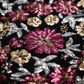 Macro close up of the multicolor floral sequin fabric on the evening gown