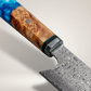Close up of the knife handle showing blue resin, burl wood, black collar bolster and mosaic pin