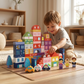 Young child happily building a colorful wooden block city on the living room floor