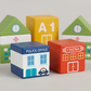 Close up of the chunky painted solid wood building blocks showing the printed building details
