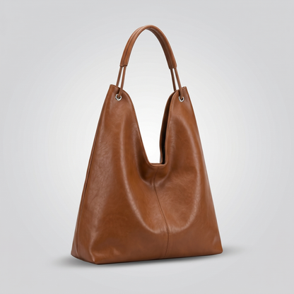 Walnut genuine leather hobo bucket tote bag shown front on a clean studio background