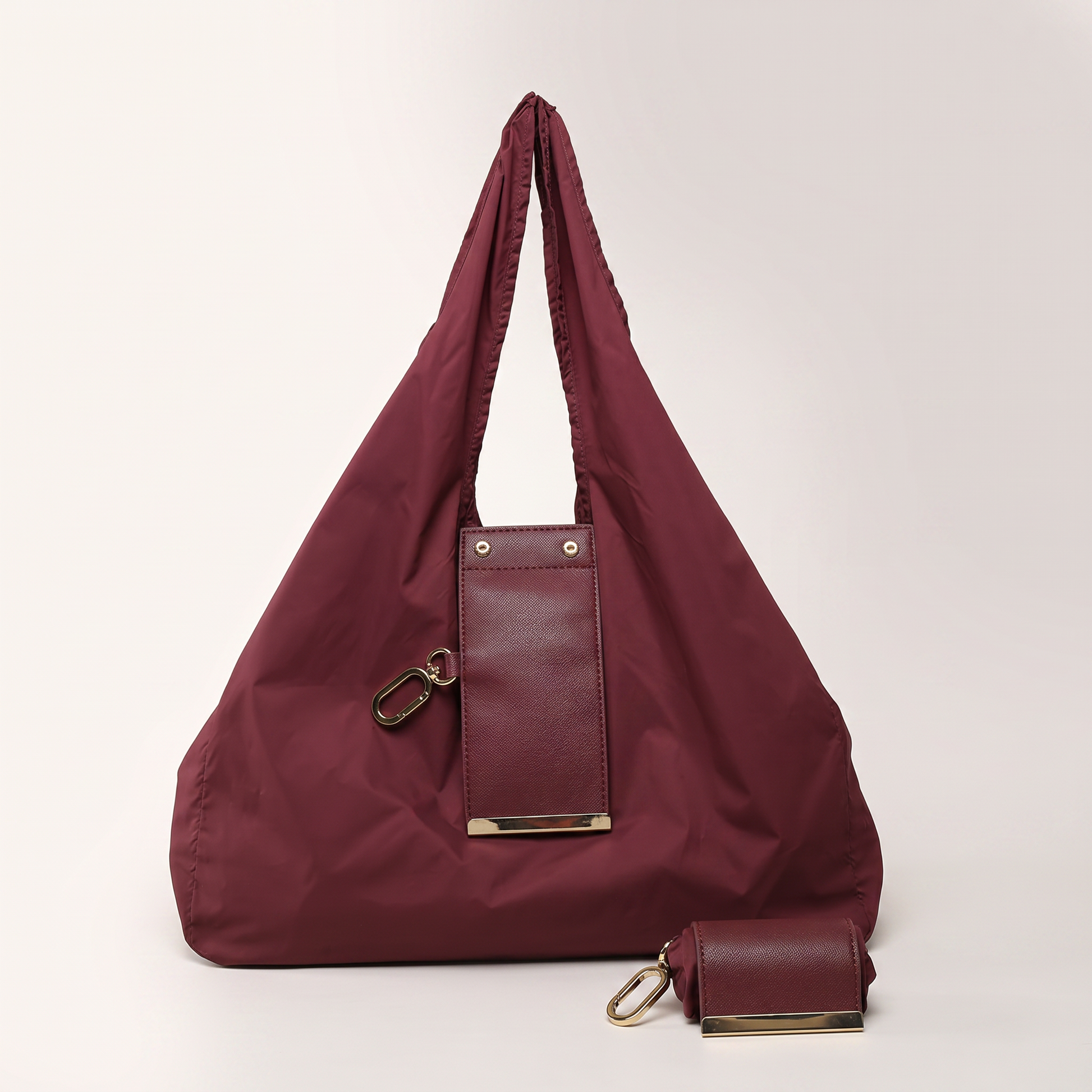 Burgundy nylon mini tote bag charm set with gold clip and leather mini pouch