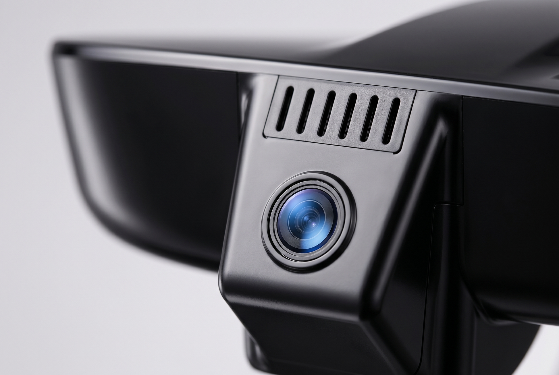 Close up of the dash camera lens and cooling vent slits