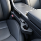 Gap filler wedged into the car seat gap holding a phone and keys within reach