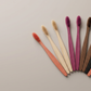 Soft bristled bamboo toothbrush set presented on a clean premium surface