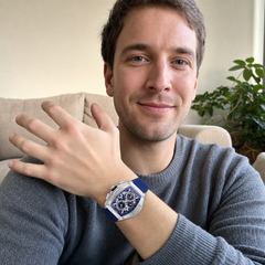 Customer wearing the CRRJU quartz watch on his wrist at home