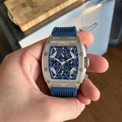Customer holding the CRRJU quartz watch to show the blue dial
