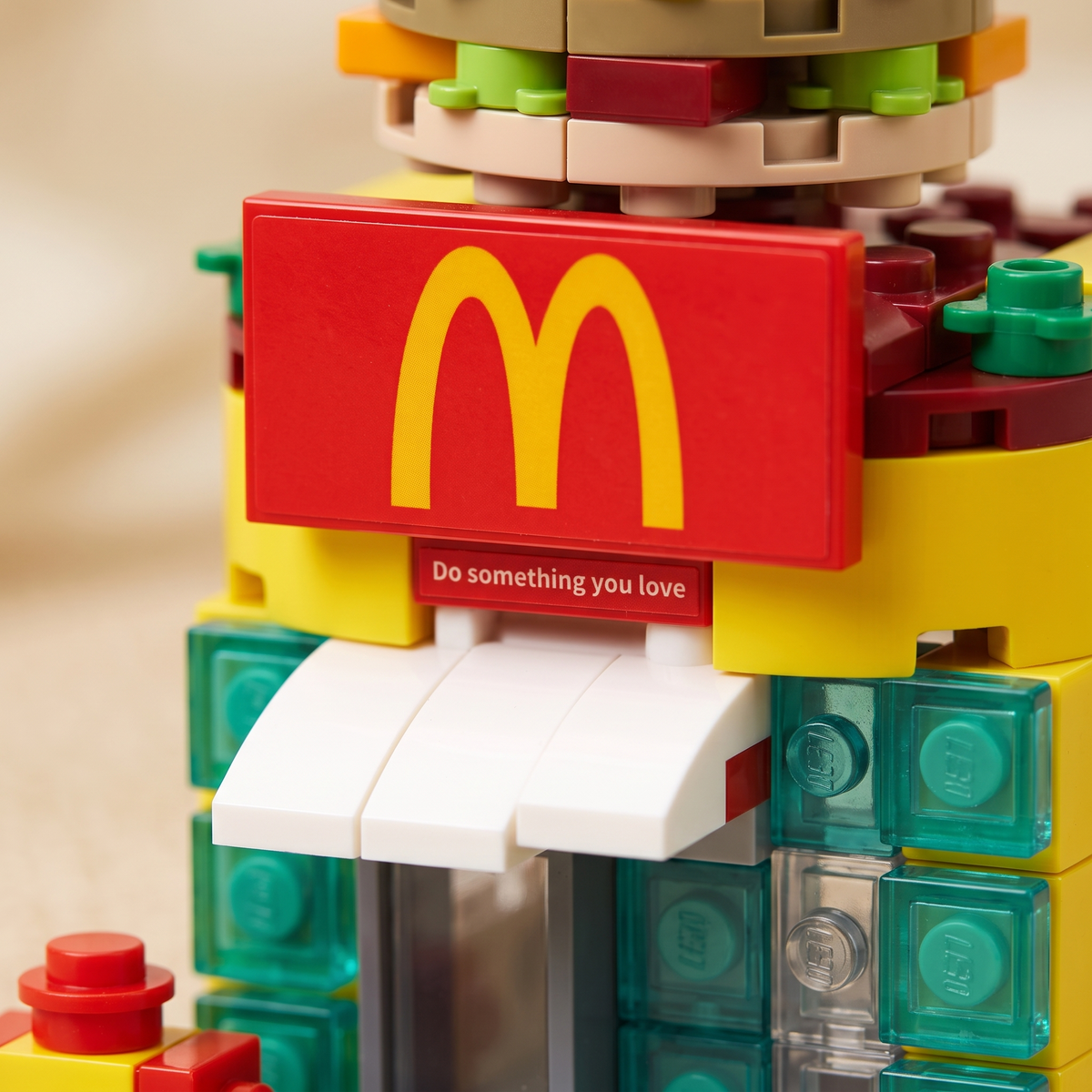 Macro of the golden arches sign panel and canopy on the McDonald themed brick shop