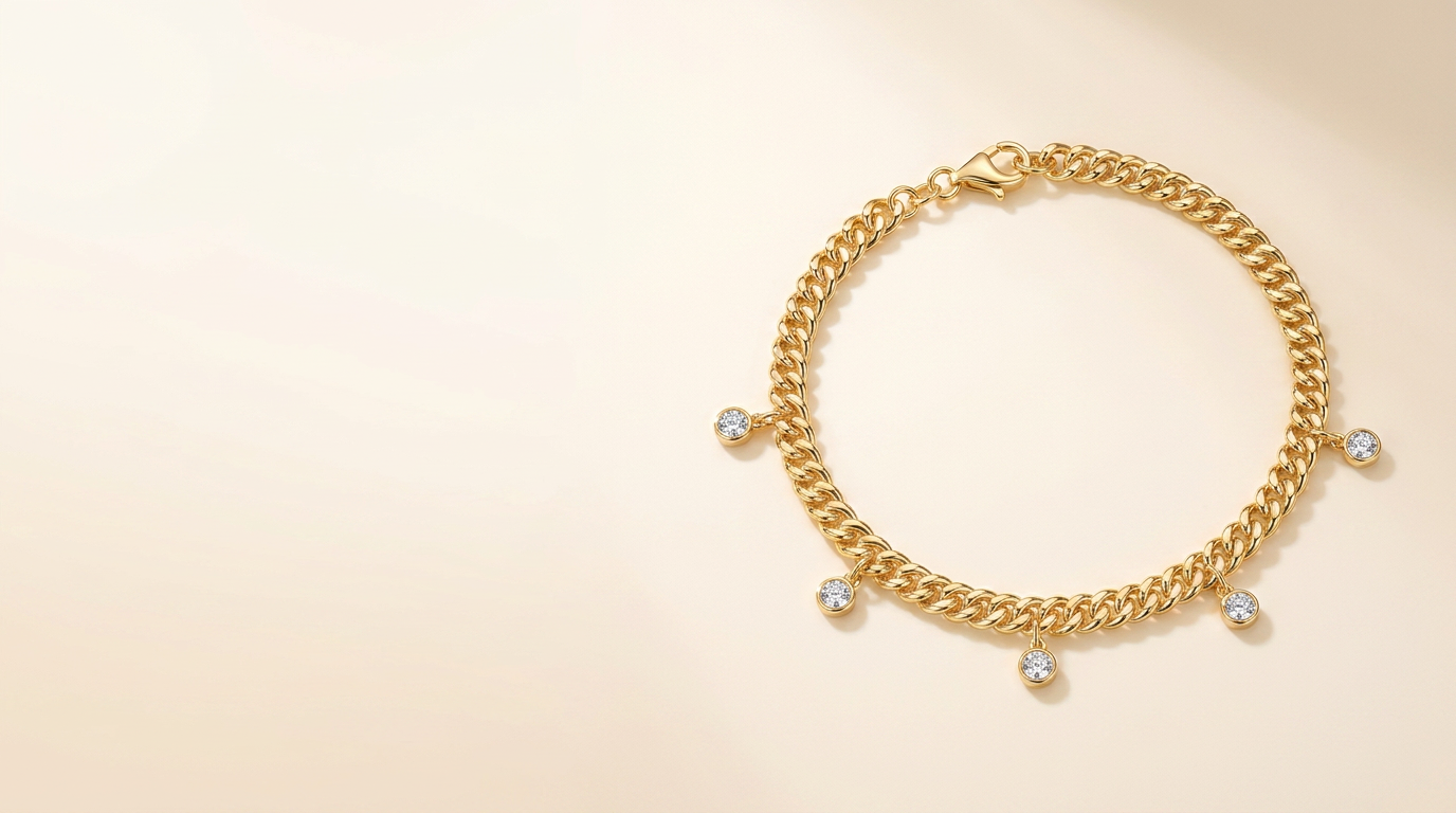 Introducing A Gold Tone Cuban Bracelet With Moissanite Drops: