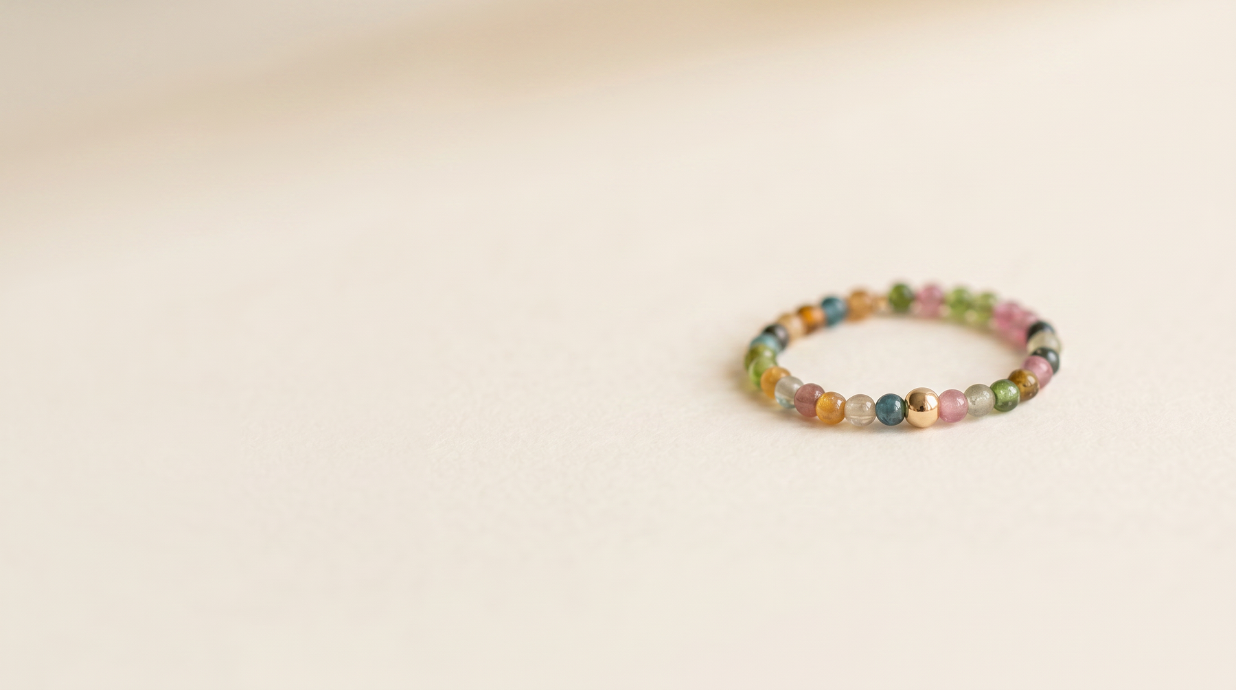 Introducing Rainbow tourmaline beaded ring, one stretch fit size: