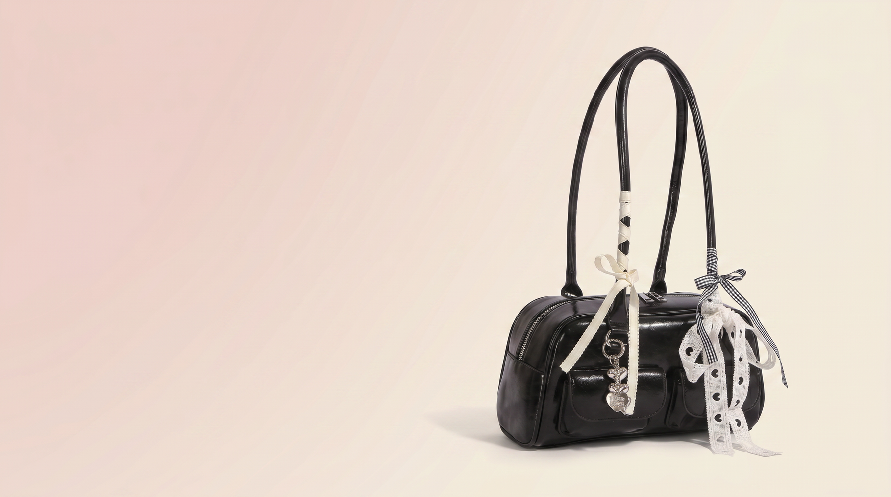 Introducing Glossy patent boston bag with bow charms: