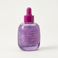 Tinted serum dropper bottle shown against a soft studio backdrop