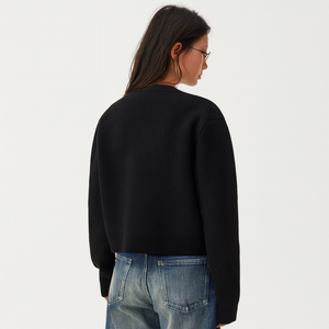 Front view of the cropped knit cardigan showing the full button placket