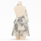 Close-up of the floral print and tiered ruffle detail on the skirt