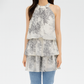 Front view of the ink wash floral halter mini dress with tiered ruffle skirt